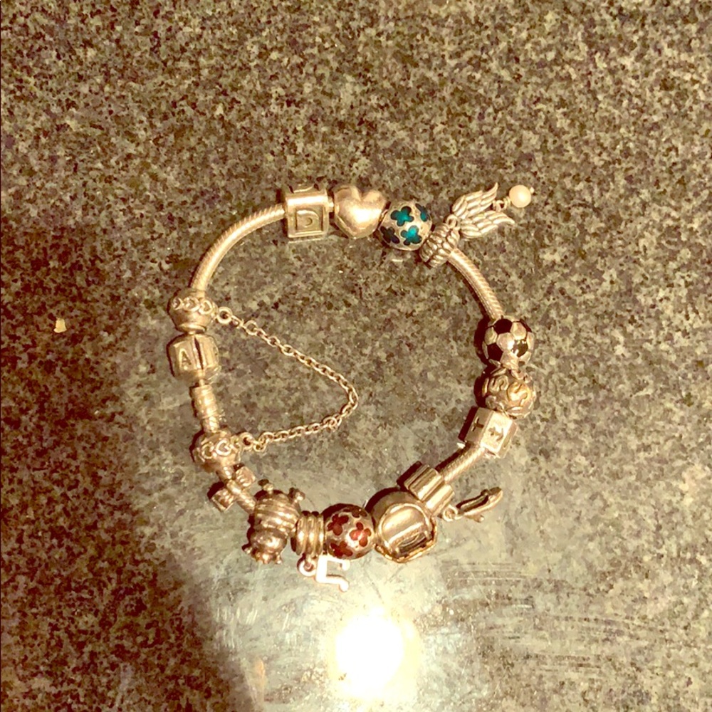 Pandora sterling silver bracelet with 14 charms
